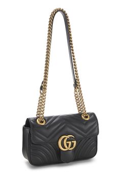 Find GUCCI Gg Marmont Shoulder Bag on Editorialist. This Gucci GG Marmont Shoulder Bag features a quilted design, a gold-tone logo, and a chain strap. It can be worn on the shoulder or crossbody. Gucci Marmont Bag, Gucci Marmont, Gucci Gg Marmont, Gucci Leather, Gg Marmont, Gucci Black, Chain Strap, Gold Tones, Black Leather