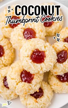 there are cookies with jam on them and the words coconut thumbprint cookies