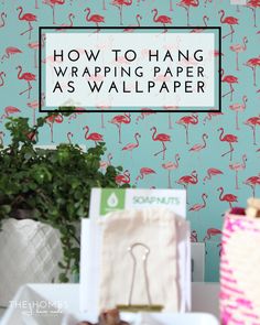 a pink flamingo wallpaper with the words how to hang wrapping paper as wallpaper