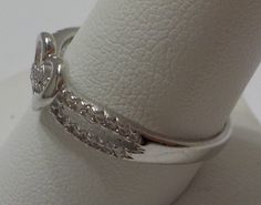 "Vintage sterling heart ring adorned with rows of tiny sparkly rhinestones. Heart is 3/8\" x 3/8\". Two rows of tiny sparkly rhinestones on both sides of the heart, and; going through the center of the heart. All rhinestones are present, intact, & SPARKLY. This is absolutely gorgeous & in excellent condition." Anniversary Rings With Diamond White Rhinestones, Anniversary Rings In Diamond White With Rhinestones, Adjustable Rhinestone Anniversary Rings, Adjustable Rhinestone Rings For Anniversary, Adjustable Sparkling Diamond Ring For Anniversary, Diamond White Diamond Ring With Rhinestones For Anniversary, Diamond White Anniversary Diamond Ring With Rhinestones, Anniversary Diamond Ring With Rhinestones, Anniversary Diamond White Ring With Rhinestones