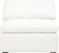 a close up of a white couch with pillows on top of it and the bottom part of the chair