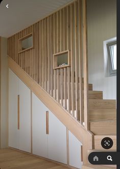 the stairs are made of wood and white