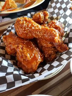 some fried food is in a basket on a table