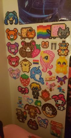 a refrigerator covered in lots of different types of stickers