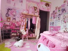 a bedroom with hello kitty decorations and pink walls