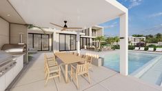 an outdoor kitchen and dining area next to a swimming pool in the middle of a house