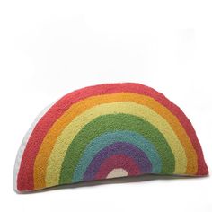 a multicolored rug with a rainbow design on the front and back of it