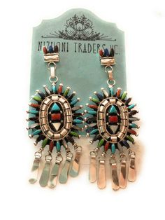 JEWELRY TYPE : Earrings MAIN STONE : Multi Stone TRIBAL AFFILIATION : Zuni METAL : Sterling Silver COUNTRY/REGION OF MANUFACTURE : United States LOT : No COUNTRY OF ORIGIN : USA Beautiful Zuni handmade Sterling Silver And Multi Stone Needle Point dangle earrings. These earrings measure just over 3 1/2 inches long and 1 1/2 inches wide. They are great pieces for any collection!! Stamped Sterling and signed by the artist.Thank you for looking. Please contact me with any questions! Exported By Expo Bohemian Multi-stone Dangle Earrings, Artisan Multicolor Long Drop Jewelry, Multicolor Clip-on Drop Earrings, Bohemian Clip-on Dangle Jewelry, Silver Multi-stone Drop Earrings, Multicolor Pierced Dangle Jewelry, Multicolor Clip-on Jewelry For Wedding, Multicolor Clip-on Wedding Jewelry, Multicolor Multi-stone Dangle Earrings