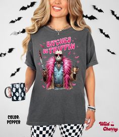 Bitches Be Trippin T-shirt, Halloween Tees, Spooky Season, Snarky Halloween Shirts, Fall Sweaters, Comfort Colors, Halloween Season, Horror Get ready for Halloween with this snarky girly Jason tee! Order a size or two up for an oversize fit! Unisex Fit. This t-shirt is made with 100% cotton (Comfort Colors). Sweaters are made with 50% cotton / 50% polyester (Gildan). Washing Instructions: Wash inside out. Machine wash in cold water. Do not bleach. Do not dry clean. Tumble dry at low heat. Halloween Novelty Tops With Funny Text, Funny Halloween Print Tops, Novelty Graphic Print Tops For Costume Party, Halloween Novelty Tops With Funny Print, Halloween Novelty Tops For Fans, Halloween Novelty Top For Fan Merchandise, Novelty Halloween Fan Merchandise Top, Fun Graphic Print T-shirt For Costume Party, Ready For Halloween