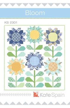 a quilt pattern with flowers on it and the words bloom written in blue, green, yellow