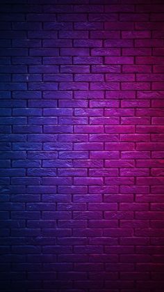 a brick wall that is painted purple and red