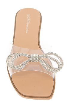 Twinkling rhinestones dazzle the bow detail of this cushioned slide sandal set atop plush memory foam. Memory foam-cushioned footbed Synthetic upper, lining and sole Imported Synthetic Sandals With Bow, Elegant Synthetic Slides For Party, Glamorous Slip-on Synthetic Sandals, Elegant Synthetic Slides With Cushioned Footbed, Bow Detail, Slide Sandals, Memory Foam, Womens Sandals, Nordstrom