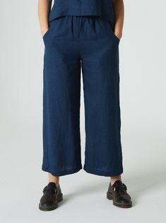 "DESCRIPTION Creating different casual outfits will be easy with this minimal and versatile pair of pants called Ocean. Be it a walk with a friend or a semi-formal meeting, the high-waisted Ocean pants will not let you down when paired with any kind of blouse or shirt. The topstitched elastic waistband, deep front pockets, and wide legs are the minimal details that can help you get the maximum. SIZING AND FIT This garment is true to size, and we recommend choosing the size you usually wear. If y Blue Linen Wide-leg Pants, Blue Wide Leg Linen Pants, Casual Wide-leg Linen Capris, Blue Linen Wide Leg Pants, Linen Straight Capris With Elastic Waistband, Straight Linen Capris With Elastic Waistband, Linen Capris With Elastic Waistband, Blue Linen Wide-leg Bottoms, Summer Wide-leg Linen Capris