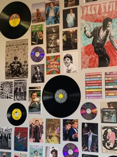 a wall covered with various records and posters