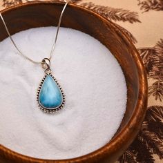 Our Larimar Gemstone Teardrop Necklace is a stunning and unique piece of boho jewelry. Crafted with high-quality .925 sterling silver and adorned with a genuine rare larimar gemstone, this western-inspired necklace ensures long-lasting beauty. Material: High-quality .925 Sterling Silver Genuine Larimar (symbolizes peace, tranquility, and harmony) Dimensions:  1" (length) x ¾" (width) Features: Perfect for everyday bohemian style Unique, one-of-a-kind design due to natural variations Handcrafted in Bali *Please note that all of our products are handmade, and variations may occur, adding to the unique charm of each piece. Stay Connected: For exclusive updates, new arrivals, and special offers, subscribe at: www.akiramco.com/subscribe Follow our journey on Instagram & Pinterest: @akiramco If Western Bohemian, Ocean Inspired Jewelry, Silver Polish, Pendant For Women, Handcrafted Artisan Jewelry, Teardrop Necklace, Rare Gemstones, Beeswax Candles, 925 Sterling Silver Earrings