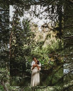 a bride and groom standing in the woods holding each other with their arms around each other