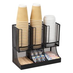 two cups and plates are stacked in a holder