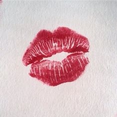 a drawing of a red lipstick on white paper