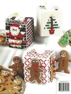 the front cover of a cross stitch book with gingerbreads, cookies and other decorations