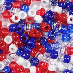 red, white and blue beads are scattered together