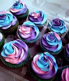 cupcakes with pink, blue and purple frosting