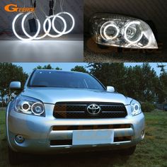 the front end of a silver toyota rav with two lights on it and an image of