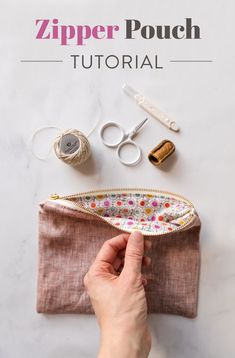 the zipper pouch sewing pattern is shown with scissors and thread