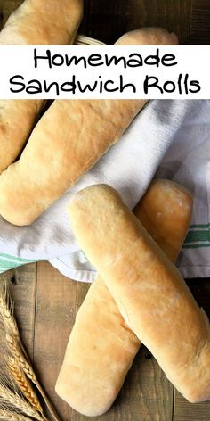 homemade sandwich rolls on a towel next to some ears of wheat