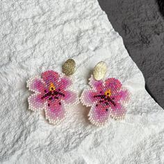 Beaded Orchid stud earrings.  Beautiful combination of colours, perfect gift for your mother, sister or for yourself. ♥️ -Materials- * Earrings are made of quality toho beads * Gold plated studs -Measurements- 📐 Earrings Length (with closure) -  2.56 inch or 6.5 cm CARE INSTRUCTIONS  So you can keep your beaded jewelry intact for longer:  - Do not take shower/bath or swim wearing beaded items, especially in salted water as it may deteriorate its colour.  - Do not sleep in them - it is not pleas Pink Beaded Flower Earrings For Gift, Handmade Pink Beaded Flower Earrings, Elegant Pink Flower Beaded Earrings, Pink Beaded Flower-shaped Jewelry, Beaded Orchid, Beaded Items, Toho Beads, Pink Orchids, Garden Lovers