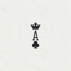 a black and white image of a crown on top of a piece of paper with the letter