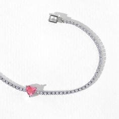 A modern twist on a timeless piece, this classic tennis bracelet features a gorgeous gradient of heart-shaped studs at its center. Trust us when we say that you'll be reaching for this one over and over. Elegant Heart-shaped Tennis Bracelet With Diamond Accents, Elegant Silver Heart-shaped Tennis Bracelet, Trendy Silver Cubic Zirconia Tennis Bracelet, Elegant White Gold Heart Tennis Bracelet, Diamond Heart-shaped Jubilee Bracelet, Elegant White Gold Heart-shaped Tennis Bracelet, Trendy Silver Tennis Bracelet As Gift, Trendy Silver Tennis Bracelet For Gift, Heart Cut Cubic Zirconia Tennis Bracelet In White Gold