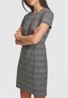 This posh A-line dress from Calvin Klein showcases a timeless houndstooth print. | Calvin Klein Women's Short Sleeve Printed A-Line Dress, 12 Chic Plaid Midi Dress For Work, Knee-length Plaid Dress For Work, Fitted Plaid Dress For Formal Occasions, Knee-length Plaid Workwear Dresses, Plaid Knee-length Dress For Work, Calvin Klein Workwear Dresses For Fall, Calvin Klein Fall Workwear Dresses, Knee-length Plaid Office Dress, Plaid Dress For Office