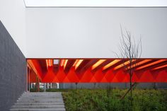 an orange and white building with stairs leading up to it