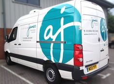 a white van parked in front of a building with an af logo on the side