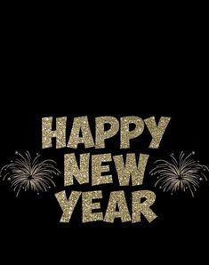 the words happy new year written in gold glitters on a black background with fireworks