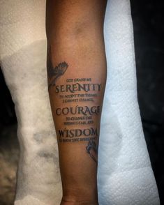 a person with a tattoo on their arm that says serenity to accept the things in courage