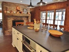 a kitchen with an oven, stove and counter top in it's center island