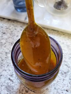 a jar filled with liquid sitting on top of a counter