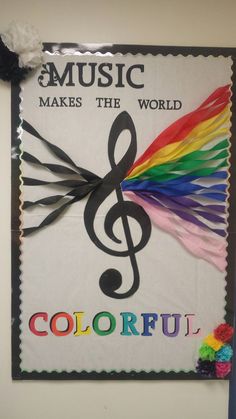 a colorful sign with music makes the world colorful