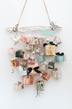 a bunch of small gifts hanging on a wall