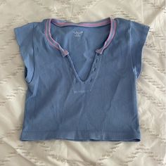 Worn Once, Almost Brand New Blue Ribbed V-neck Tank Top, Blue Short Sleeve Stretch Tank Top, Casual Blue V-neck Crop Top, Urban Outfitters V-neck Crop Top, Light Blue Ribbed Sleeveless Tank Top, Blue Ribbed Cotton Crop Top, Light Blue Ribbed Tank Top, Urban Outfitters Cotton V-neck Tank Top, Urban Outfitters Seamless V-neck Top