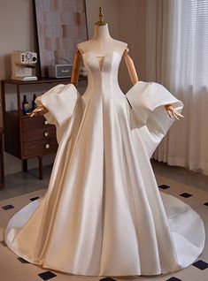 a mannequin dressed in a white wedding dress