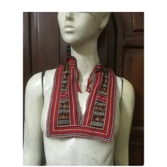 Vintage tribal red Dao women Bib. It is over 25 years and still great condition . It seems that formerly all or most Dao women wore an undergarment beneath their tunic to cover their chest. It is produced with handmade,hand stitched applique,hand embroidered,hand sawed in silk and cotton threads. Have nice metal coins pieces for decoration. Measurements Front size 18.5 cm*24 cm Back size 20 cm-50 cm Weight 125 grams Traditional Red Tops For Festival, Red Folk Style Top For Festival, Hand Saw, Jewellery Making Materials, Hand Applique, Man Set, Cotton Thread, Bibs, Hand Stitching