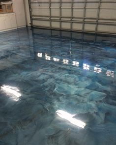 a garage floor that has been painted blue