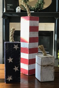 two wooden blocks with rope wrapped around them sitting on a table in front of a fireplace