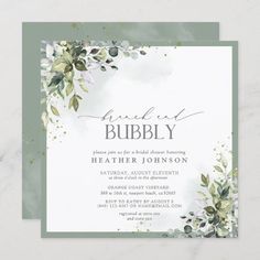 an elegant wedding card with greenery and leaves on the front, in grey tones