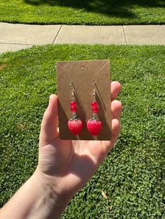 Imagine you're sitting next by the pool soaking up the sun, drinking a strawberry lemonade wearing these cute strawberry earrings, what an amazing way to spend the summer right?  These super cute earrings are light in weight and are accessorized with red beads to help bring out more color! Strawberry Earrings, Cute Strawberry, Red Beads, Strawberry Fields, Strawberry Lemonade, Red Bead, Cute Earrings, The Pool, Lemonade