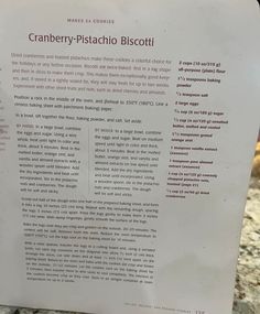 a sign describing cranberry pistachio biscotti on a counter top