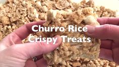 two hands are holding up some cereal bars with the words churro rice crispy treats