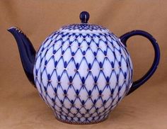 a blue and white ceramic tea pot